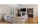 Bright living room featuring a fireplace, built-in shelving, and a large sectional sofa at 422 River Ridge Ln, Timberlake, NC 27583