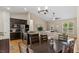 Open concept kitchen with a large island, stainless appliances, and a dining area at 422 River Ridge Ln, Timberlake, NC 27583