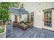 Back deck featuring outdoor furniture, an umbrella, and a view of the landscaped yard at 50 Peggy Ct, Raleigh, NC 27603