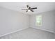 Bedroom featuring a ceiling fan, neutral paint, and carpet flooring at 50 Peggy Ct, Raleigh, NC 27603