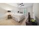 Bedroom with carpet, a window with white curtains, and a ceiling fan at 50 Peggy Ct, Raleigh, NC 27603