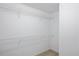 Walk-in closet with wire shelving and neutral-colored carpet at 50 Peggy Ct, Raleigh, NC 27603