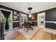 Cozy dining area showcases stylish decor, wood floors, and natural light at 50 Peggy Ct, Raleigh, NC 27603
