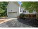 Charming home featuring a two-car garage, white siding and a welcoming front porch at 50 Peggy Ct, Raleigh, NC 27603