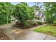 Charming home featuring a two-car garage, an inviting porch, and lush landscaping at 50 Peggy Ct, Raleigh, NC 27603