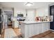 Bright kitchen with white cabinets, a center island, and stainless steel appliances at 50 Peggy Ct, Raleigh, NC 27603