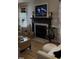 Living room featuring a fireplace, hardwood floors, and neutral furniture at 50 Peggy Ct, Raleigh, NC 27603