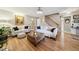 Elegant living room with hardwood floors, comfortable seating, and an abundance of natural light at 50 Peggy Ct, Raleigh, NC 27603