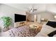 Bonus room boasts a large TV, area rug, ceiling fan, and comfortable seating at 50 Peggy Ct, Raleigh, NC 27603