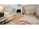 Spacious bonus room with neutral walls, TV, area rug, and cozy seating area at 50 Peggy Ct, Raleigh, NC 27603