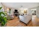 Bright and airy living room featuring a fireplace, hardwood floors, and stylish decor at 50 Peggy Ct, Raleigh, NC 27603