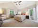 Bright main bedroom with vaulted ceiling, carpet, and neutral walls at 50 Peggy Ct, Raleigh, NC 27603