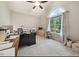 Bright office space with neutral walls, plush carpeting, fan and an arched window providing natural light at 50 Peggy Ct, Raleigh, NC 27603