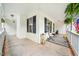 Inviting porch area with neutral furnishings and patriotic decor at 50 Peggy Ct, Raleigh, NC 27603