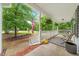 Relaxing porch with comfortable seating and views of the well-manicured front yard at 50 Peggy Ct, Raleigh, NC 27603