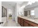 Elegant bathroom with dual vanity, granite countertops, and a separate tiled shower at 5104 Windmere Chase Dr, Raleigh, NC 27616