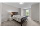 Bedroom featuring a bed, night stand, and a window at 5104 Windmere Chase Dr, Raleigh, NC 27616