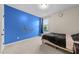 Bedroom featuring a bed and a bright blue wall with stickers at 5104 Windmere Chase Dr, Raleigh, NC 27616