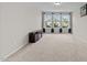 Bonus room featuring a television and large windows at 5104 Windmere Chase Dr, Raleigh, NC 27616