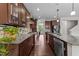 Spacious kitchen featuring granite counters, wood cabinets, hardwood floors and stainless appliances at 5104 Windmere Chase Dr, Raleigh, NC 27616