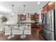 Beautiful kitchen with dark wood cabinets, stainless steel appliances, and granite countertops at 5104 Windmere Chase Dr, Raleigh, NC 27616