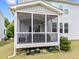 Inviting screened porch with comfortable seating, offering a relaxing outdoor living space at 5104 Windmere Chase Dr, Raleigh, NC 27616
