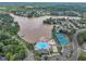 Aerial view showcasing the community's pool, tennis courts, lake access and well-maintained landscaping at 522 Crossview Ln, Durham, NC 27703