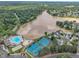 Aerial shot displays community pool, tennis courts, playground, lake access, and surrounding homes at 522 Crossview Ln, Durham, NC 27703