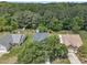 Aerial view of the home showcasing its location amongst mature trees and landscaping at 522 Crossview Ln, Durham, NC 27703