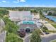 Stunning aerial view of community pool, clubhouse, lake, tennis courts, and lush green surroundings at 522 Crossview Ln, Durham, NC 27703