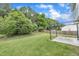 Spacious backyard features a concrete patio area, lush lawn and mature landscaping at 522 Crossview Ln, Durham, NC 27703