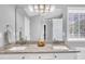 This spacious bathroom includes double sinks with granite counters, and a large mirror at 522 Crossview Ln, Durham, NC 27703