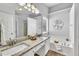 A well-lit bathroom features double sinks, granite counters, a soaking tub, and a shower at 522 Crossview Ln, Durham, NC 27703