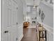 Open entryway flows into a living room featuring a fireplace and hardwood floors at 522 Crossview Ln, Durham, NC 27703