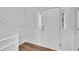 Inviting entryway featuring wood flooring, white trim, and a stylish front door at 522 Crossview Ln, Durham, NC 27703