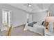 The main bedroom features neutral decor, an ensuite bath, a sitting area, and carpeted floors at 522 Crossview Ln, Durham, NC 27703