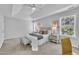A view of the main bedroom features neutral decor, tray ceilings, and ensuite access at 522 Crossview Ln, Durham, NC 27703