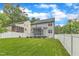 Expansive backyard featuring green grass and privacy fence at 5412 Robbins Dr, Raleigh, NC 27610