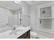 Bright bathroom features marble countertop, classic framed mirror, and natural lighting at 5412 Robbins Dr, Raleigh, NC 27610