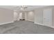 Large bedroom offering neutral paint, carpet, ceiling fan, and two doors at 5412 Robbins Dr, Raleigh, NC 27610