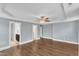 Large bedroom features hardwood floors, trey ceiling, ceiling fan, and adjacent bathroom at 5412 Robbins Dr, Raleigh, NC 27610