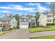 Charming home with gray siding, a driveway, and landscaping at 5412 Robbins Dr, Raleigh, NC 27610