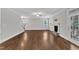 Bright living room featuring hardwood floors, a fireplace, and large windows for plenty of natural light at 5412 Robbins Dr, Raleigh, NC 27610