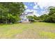 An expansive lawn with a charming home and deck at 59 Troy Dr, Fuquay Varina, NC 27526