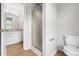 Bathroom featuring a glass-enclosed shower and a vanity, offering style and convenience in a compact space at 59 Troy Dr, Fuquay Varina, NC 27526