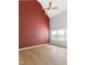 Large primary bedroom with hardwood floors, neutral paint and big windows providing lots of light at 59 Troy Dr, Fuquay Varina, NC 27526