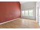 Spacious primary bedroom with hardwood floors, large windows, and natural light at 59 Troy Dr, Fuquay Varina, NC 27526