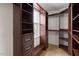 Custom closet with wooden built-in shelving and drawers providing ample storage and organization in the home at 59 Troy Dr, Fuquay Varina, NC 27526