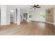 Bright living area with hardwood floors, decorative columns, and an open staircase at 59 Troy Dr, Fuquay Varina, NC 27526
