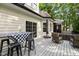 Back deck area with a dining table, stools, and a cozy seating area at 5916 Two Pines Trl, Wake Forest, NC 27587